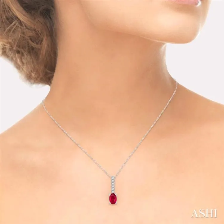 1/20 Ctw Round Cut Diamond and Oval Cut 6x4mm Ruby Precious Pendant in 10K White Gold with chain