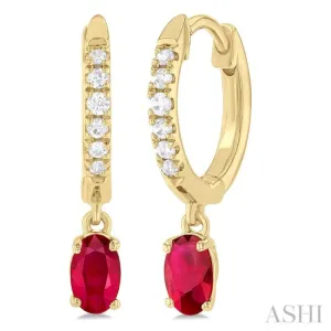 1/8 ctw Petite 5X3MM Oval Cut Ruby and Round Cut Diamond Precious Fashion Huggies in 10K Yellow Gold