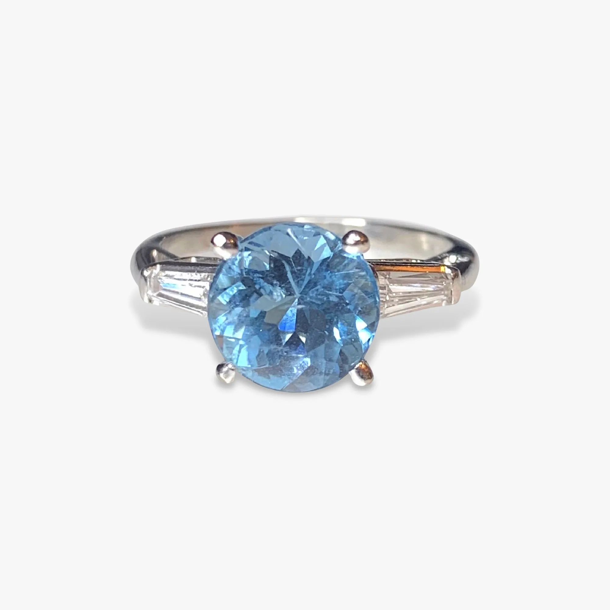 Platinum Round Aquamarine and Tapered Baguette Diamond Three-Stone Ring