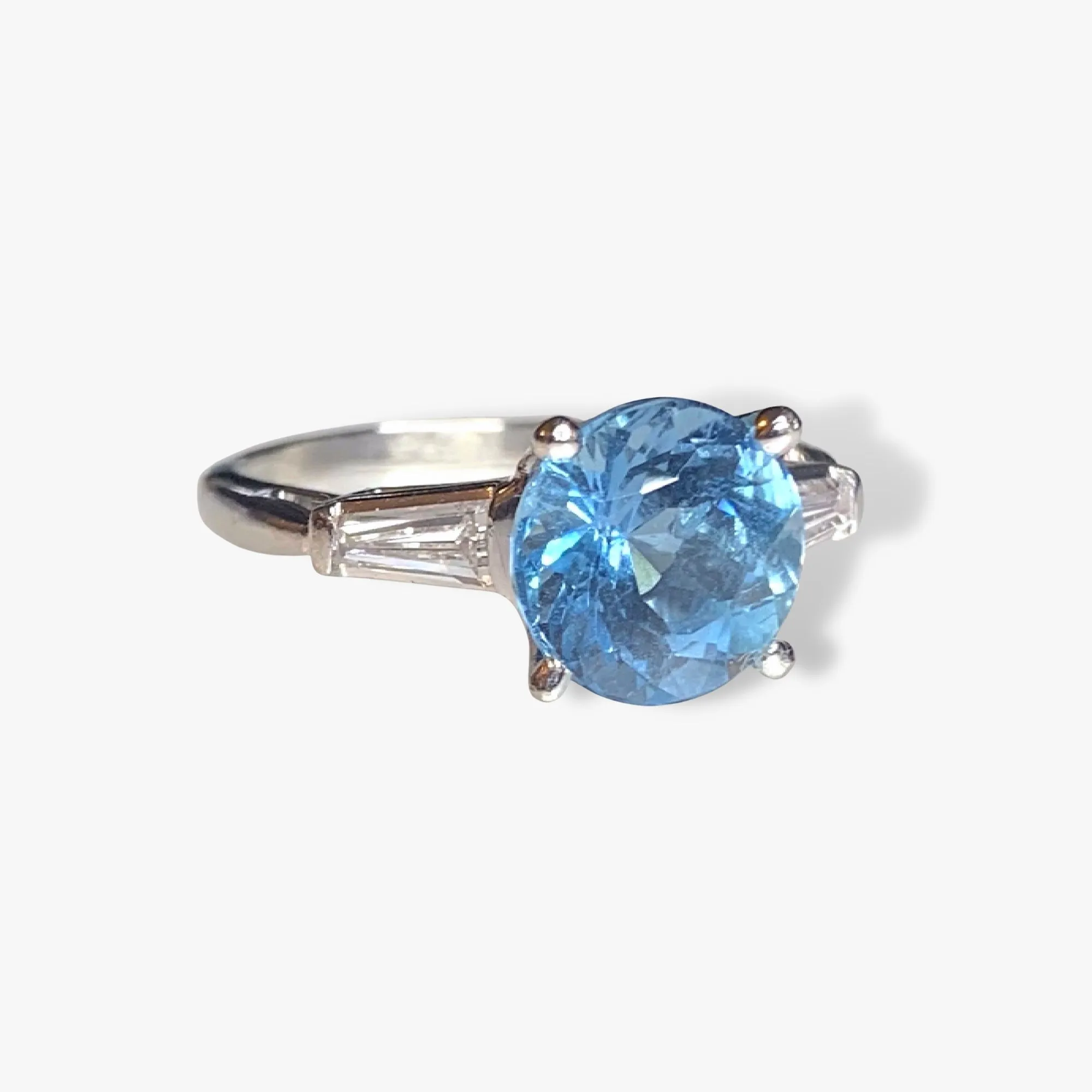 Platinum Round Aquamarine and Tapered Baguette Diamond Three-Stone Ring