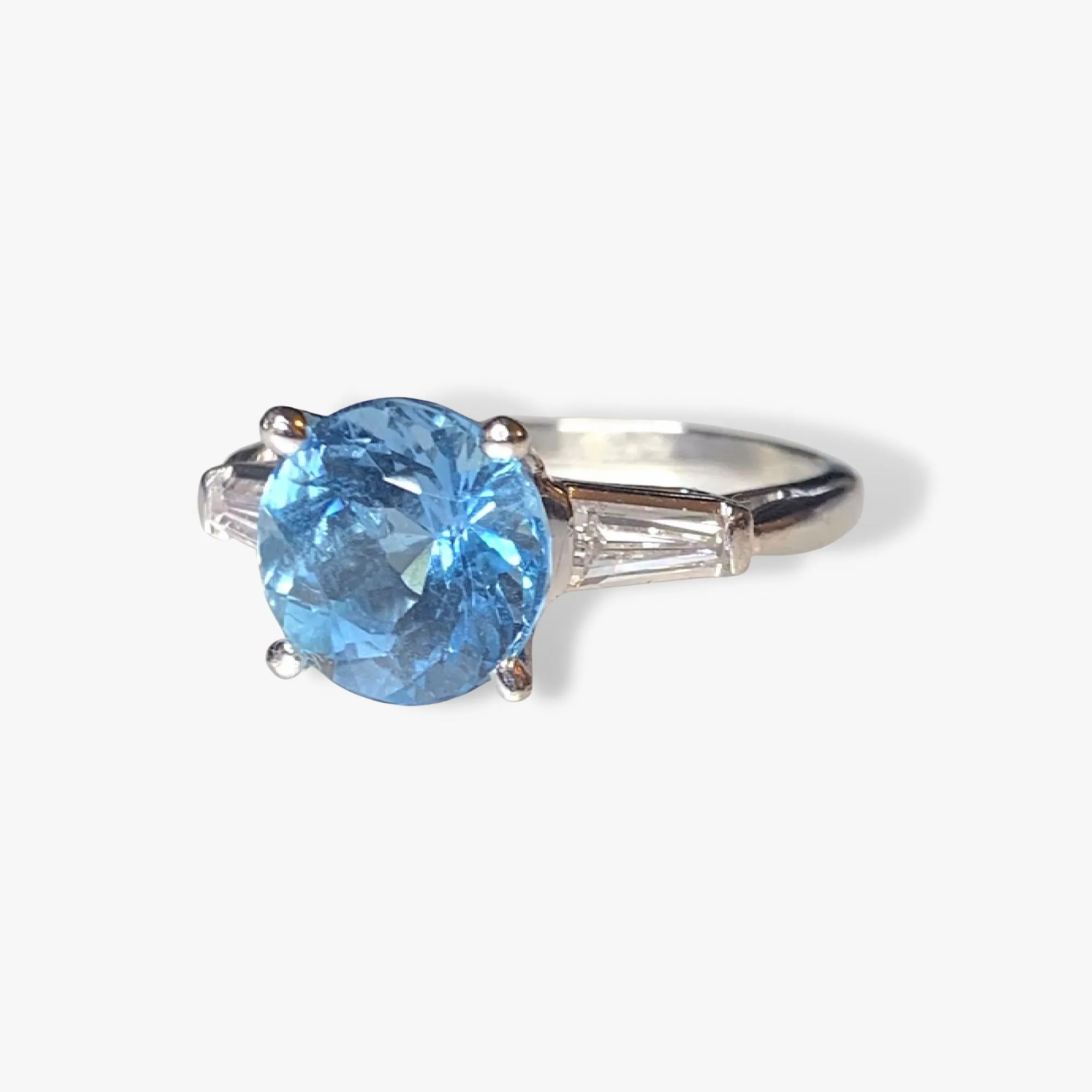 Platinum Round Aquamarine and Tapered Baguette Diamond Three-Stone Ring