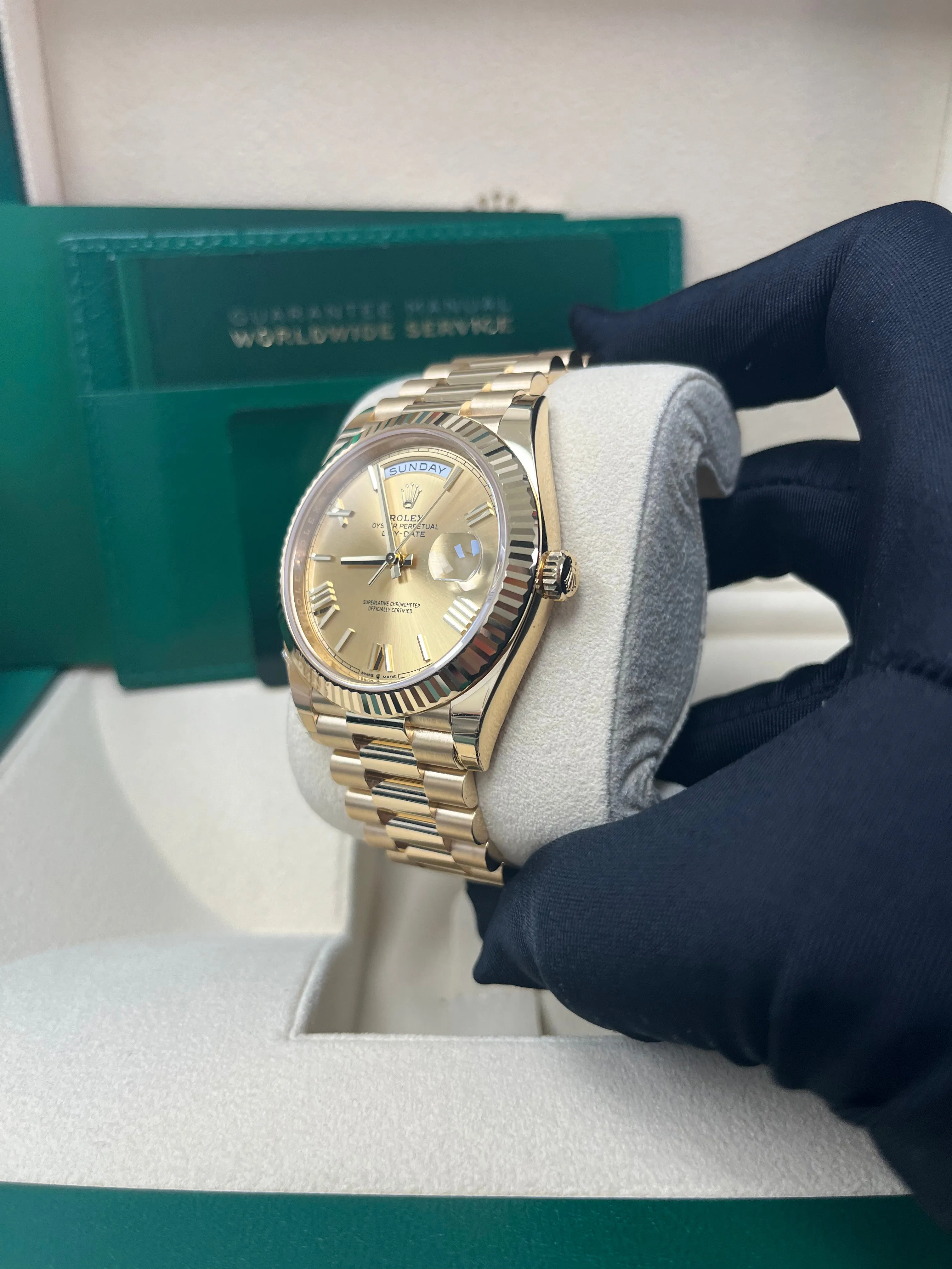 Rolex Day-Date 40 Yellow Gold Champagne Roman Dial Fluted Bezel (Ref # 228238)